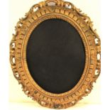 Oval gilded wooden frame. 70 x 57cm.