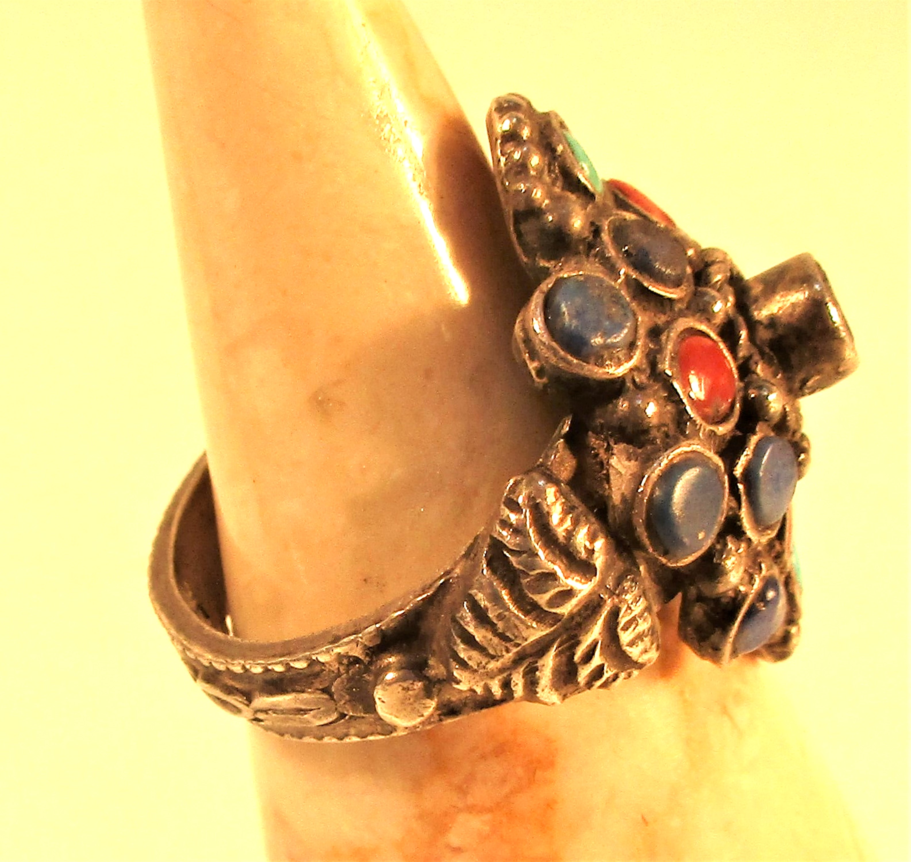 A tribal ring set with lapis lazuli, cornelian and turquoise. - Image 2 of 2