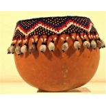 Calabash drinking cup with bead decoration.. 10 x 12cm. Early 21st c.