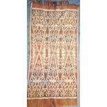 Toraja wrap from Sulawesi. Warp-Ikat weave in hand spun raw cotton. It is woven in two halves on a
