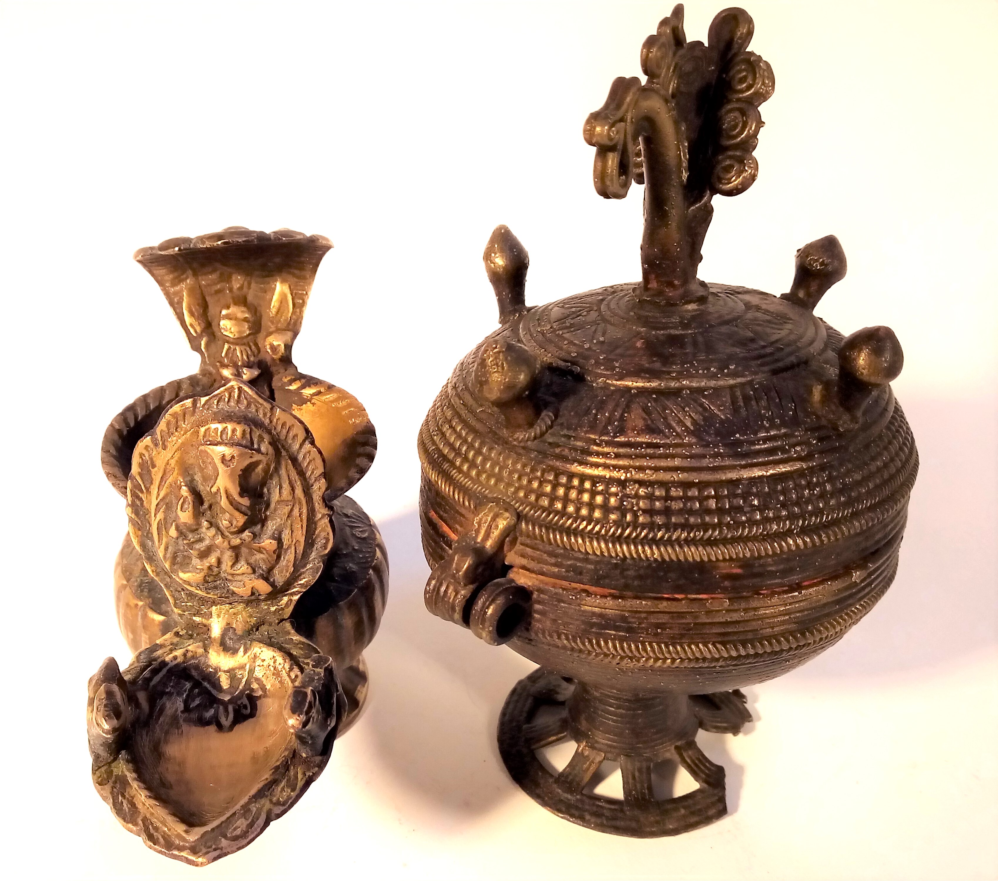 Cast brass container and lamp from India. The pot is used for kohl or binde, the lamp is a small oil