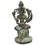 Bronze statue of the Hindu god Vishnu. He holds in his four hands the four symbols of the Hindu