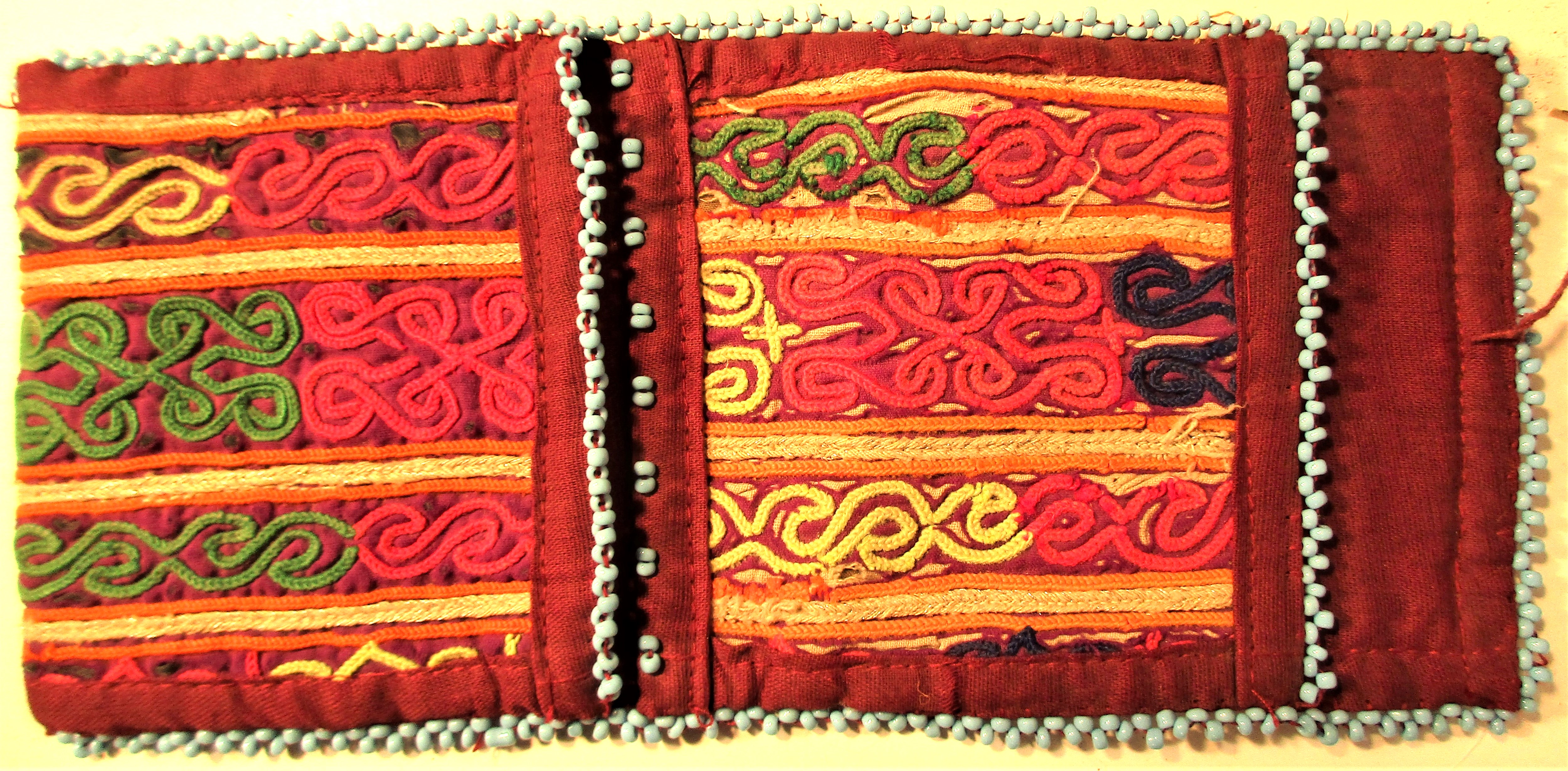 Purse. There are tribal and regional traditions in the pattern and type of stich in every purse.