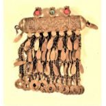 A very decorative old amulet with floral decoration and glass beads. Multiple metal drops. An amulet