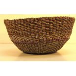 Round basket made from tightly woven coloured coir. 25 x 12cm.
