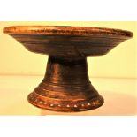 Lombok stand carved from Panggal Buaya. It is inlaid with tiny shards of abalone shell. These
