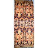 Hinggi from Sumba, Indonesia. The warp-ikat weave in cotton shows 2 smiling angels repeated at