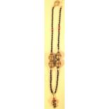 Necklace with antique metal beads strung on glass bead necklace. 32cm.