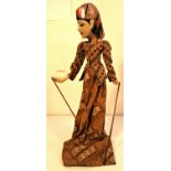 Wayang Golek from Java. A very demure looking puppet well dressed in a batik sarong. The wayang