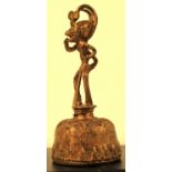 Cast brass bell from Indonesia, the handle is a monkey with a stylised head dress. 14 x 6cm. New