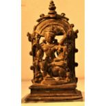 Cast bronze of lord Vishnu with Lakshmi kneeling on Nadim, the bull. 10 x 6cm. India. New.