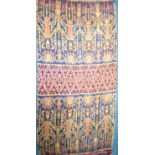 Hinggi from Sumba. A warp-ikat cotton textile. Using vegetable dyes, there are four figures at