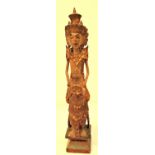 A typical small carving of Sri Dewi, the rice goddess from Bali. 33 x 6cm. Early 21st c.