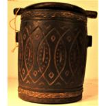Torba Batak storage pot. Used for storing rice, with carving and rattan plaited bands binding the