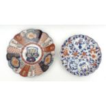 Two Japanese Imari plates, of lotus form, one richley decorated to each petal, with clouds over,