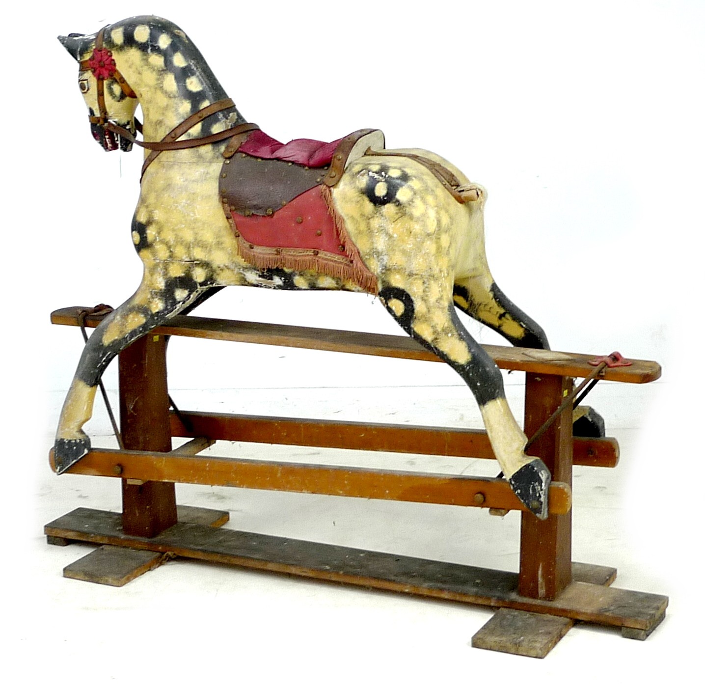 A mid 20th century carved wooden rocking horse, dappled grey coat, red saddle, on a pine base with - Image 2 of 4