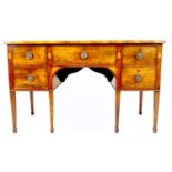 A George III mahogany and fan paterae inlaid sideboard, with five drawers, brass ring handles,
