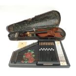 A twelve bar Rosetti, German autoharp, painted black with roses to the board, 51 by 32cm, together
