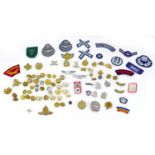 A collection of circa WWII and later British and Commonwealth Army and RAF badges and buttons,