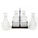 Two pairs of cut glass decanters, comprising a Victorian pair with ovoid bodies and mushroom