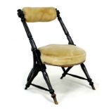A late Victorian ebonised and gilt side chair, with fluted angled supports, bolster shaped cross