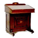 An Edwardian mahogany and inlaid Davenport desk, with lift lid opening to reveal a fitted