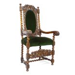 A 19th century Italianate style carved oak armchair, with upholstered seat and back rest, 65 by 70