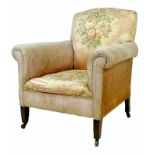 A Victorian armchair, with scroll arms, upholstered in striped velvet with floral satin to the