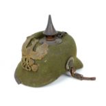 A WWI German felt ersatz Pickelhaube helmet, with both helmet plates, faint stamped marks to the