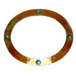 An Arts & Crafts copper oval form framed mirror, inset with four green tiles, 64.5 by 53 by 3cm.