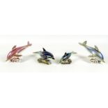 A group of four Royal Crown Derby paperweights, all modelled as dolphins, comprising 'Pink