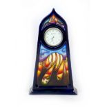 A rare Moorcroft Jacaranda pattern table clock, the first trial piece (out of two trial pieces) to