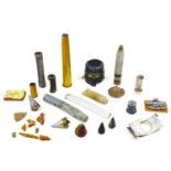 A collection WWII aircraft relics and inert shells, including an aeronautical compass, a shell
