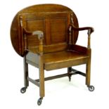 An Edwardian oak unusual monk's bench/butler's tray tea trolley, bearing a 'Patent Applied For'