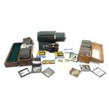 A large collection of vintage glass slides including some early 20th century photographic slides, in