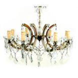 A glass and brass eight branch chandelier, with cut glass droplets, 60 by 52cm high.