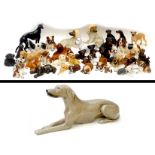 A large litter of over forty china figurines, all modelled as dogs, featuring various different
