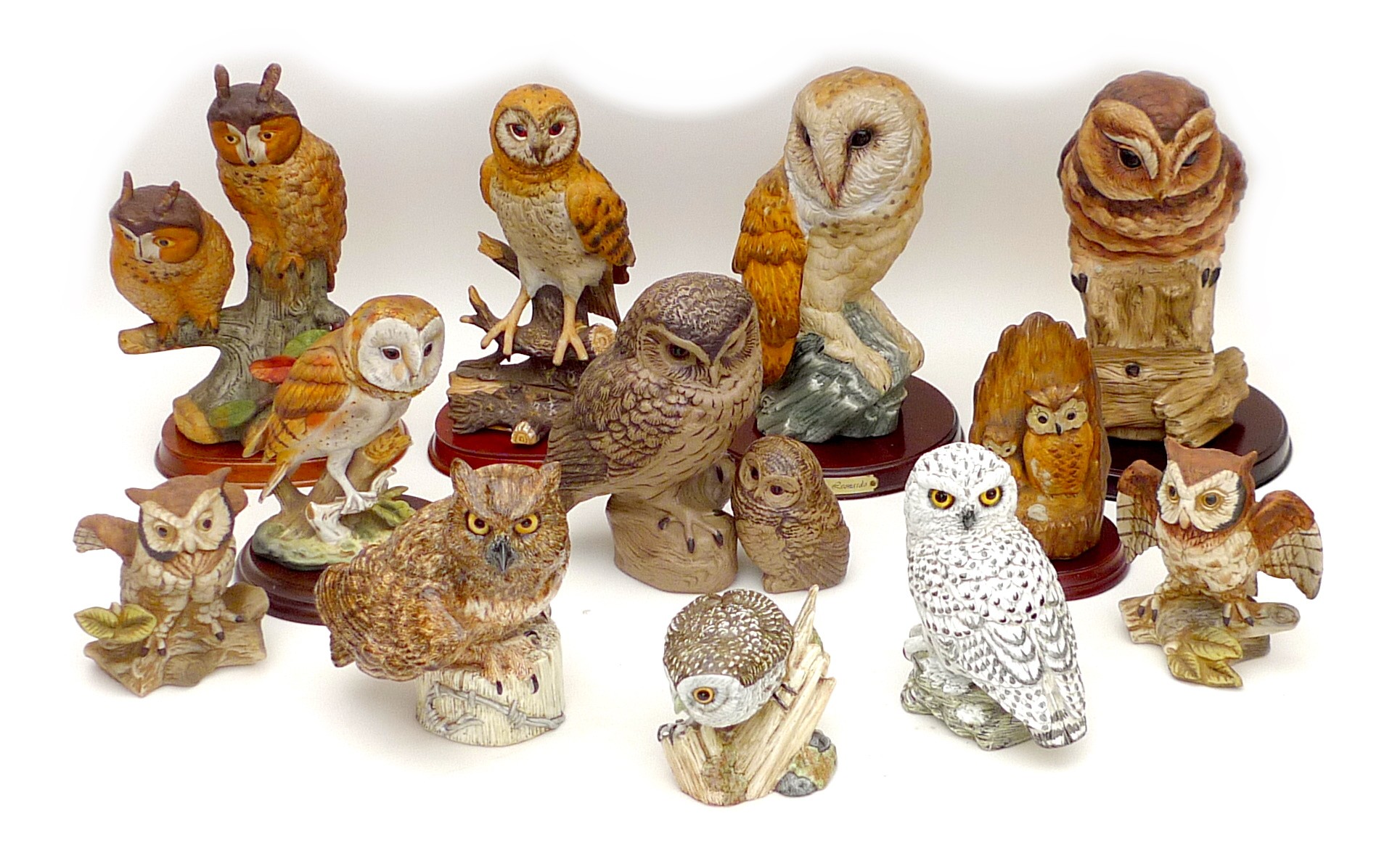 A group of twelve large owl figurines, including three Mack figurines, 'Little Owl', 11.5 by 9 by