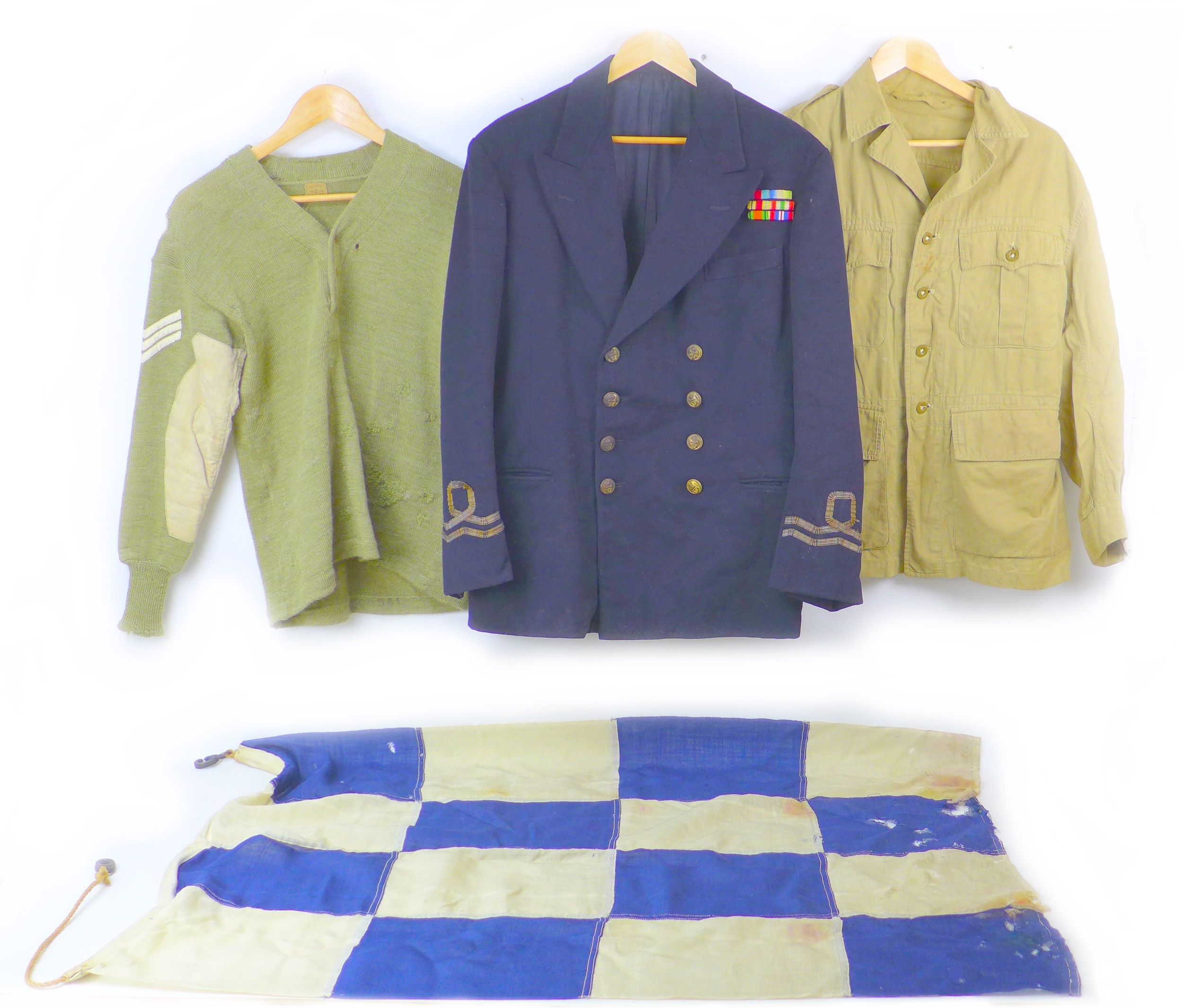 Three pieces of WWII uniform, naval officer's tunic with economy braiding, ribbons and buttons, a