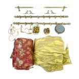 A group of brass curtain rails and curtains, including a pair of rails with pineapple finials and