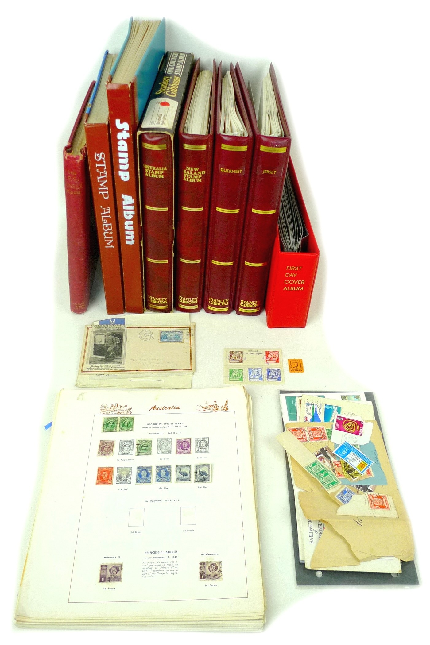 Eight stamp albums containing stamps of the British Commonwealth, including Stanley Gibbons One