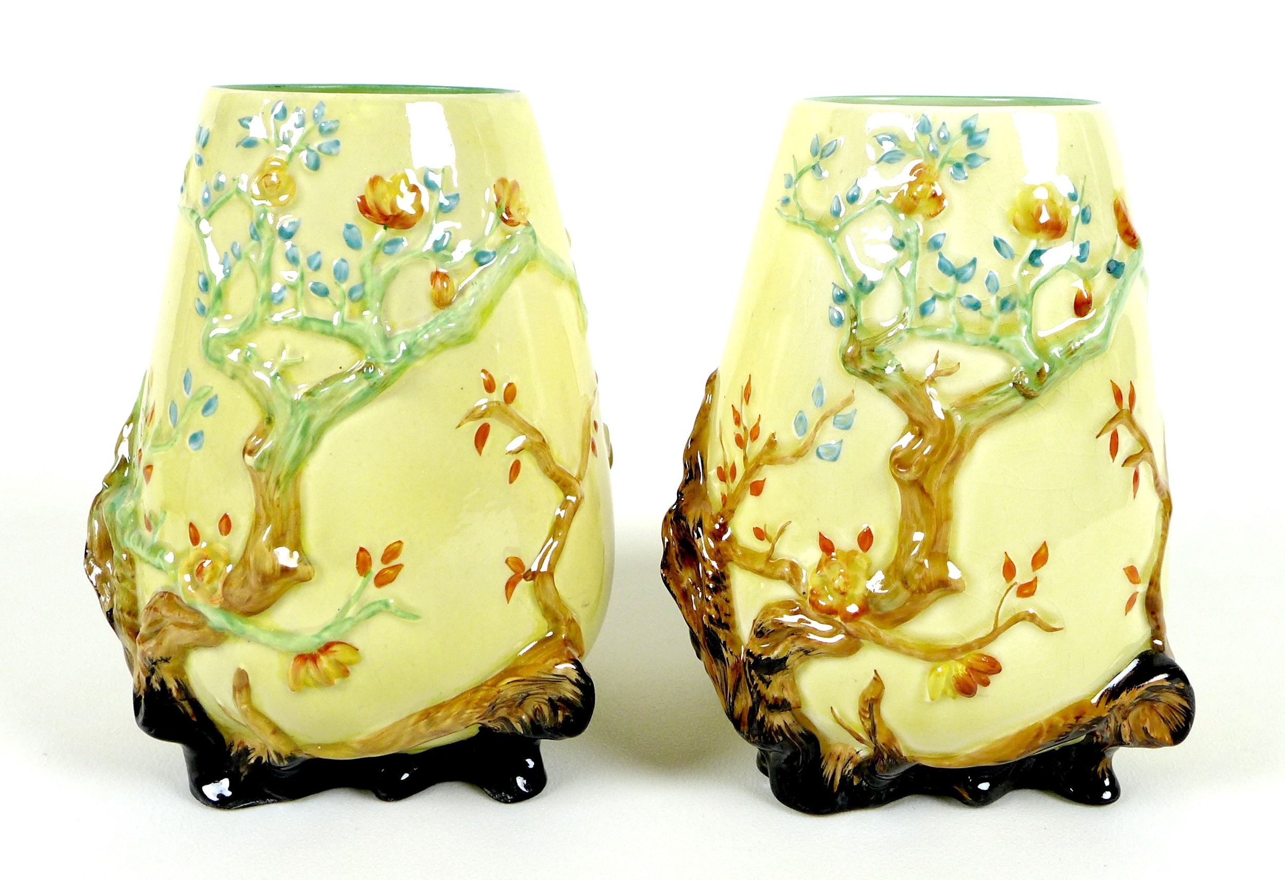 A pair of Clarice Cliff My Garden vases, pattern number 989 of moulded form, green back stamp