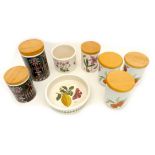 A group of vintage storage pots with wooden lids, comprising two Portmeirion 'Magic City' pattern,