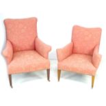 A pair of Edwardian armchairs, with outswept scroll arms, raised on square section legs with pink