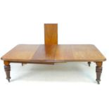 A Victorian mahogany extending dining table, 301 by 136 by 74cm high fully extended, 154 by 136 by