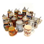 A collection of modern drinking steins, with moulded and printed decoration, most with metal