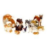 A group of twelve West German and Russian china animal figurines, including dogs, bears, and a