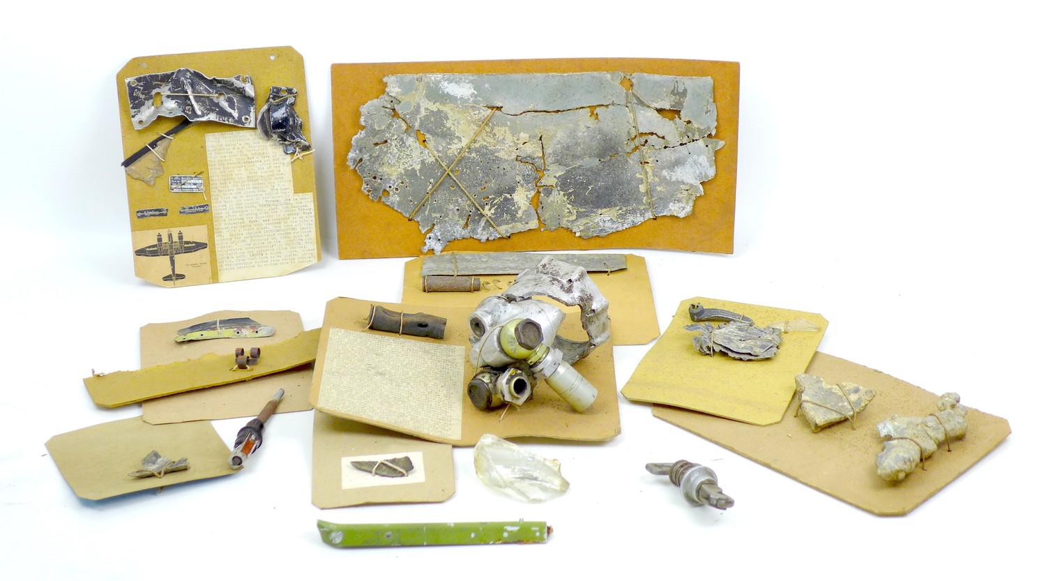 A collection of WWII German aircraft wreckage, including an Messerschmitt BF 110 engine part,