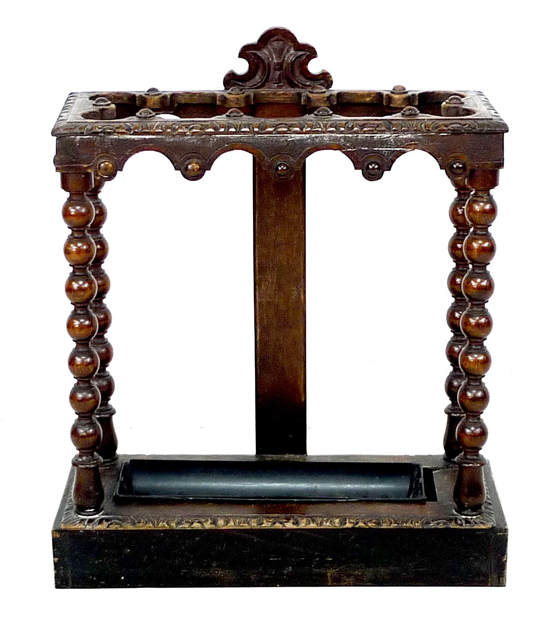 A late Victorian carved oak umbrella stand, with bobbin turned supports and removable drip tray, - Image 2 of 3