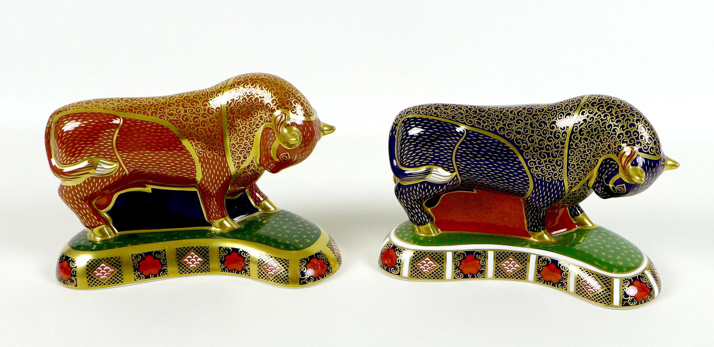 Two Royal Crown Derby paperweights, modelled as 'Harrods Bull', one of a limited edition of 400
